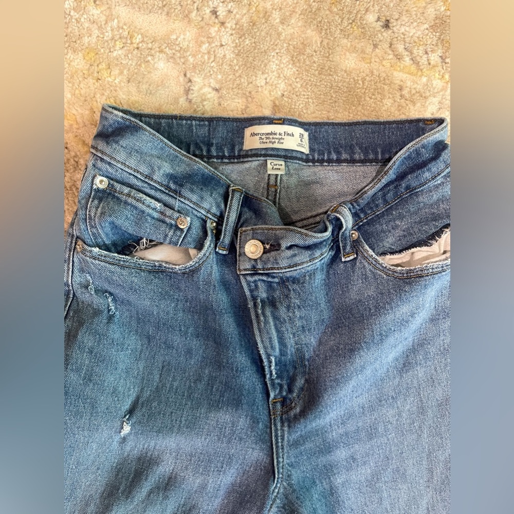 Abercrombie and Fitch 90s ultra high rise blue jeans with cross cross waist band